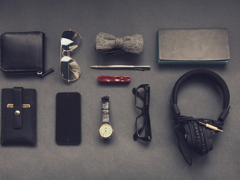 black corded headphones near eyeglasses