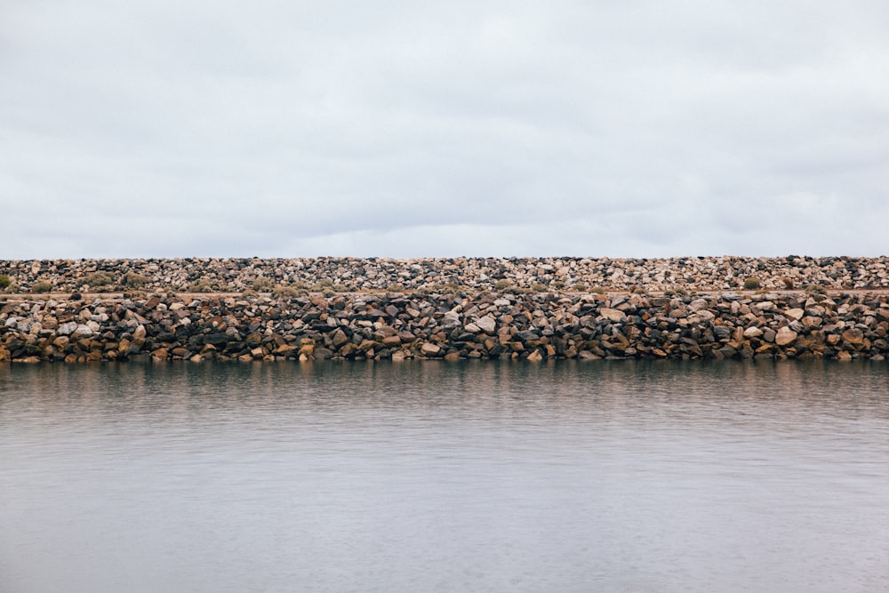 water rock wall during daytime