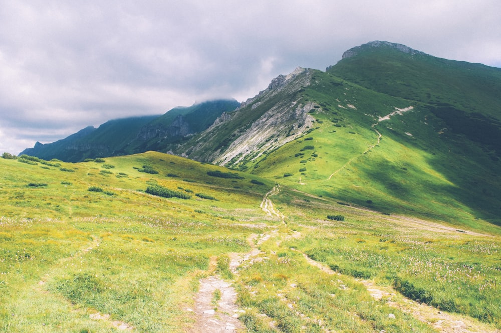 green mountain under cloudy sky