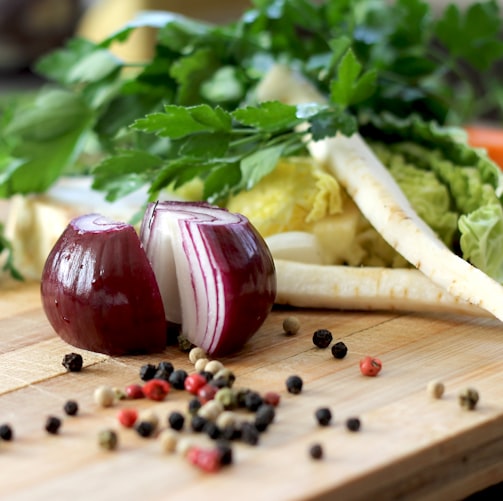 red onion on brown wooden chopping board