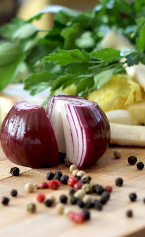 red onion on brown wooden chopping board