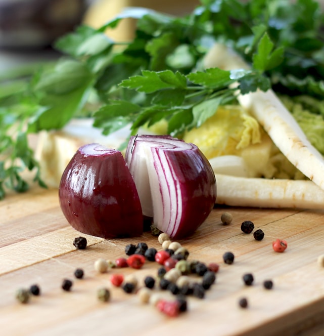 red onion on brown wooden chopping board