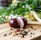 red onion on brown wooden chopping board