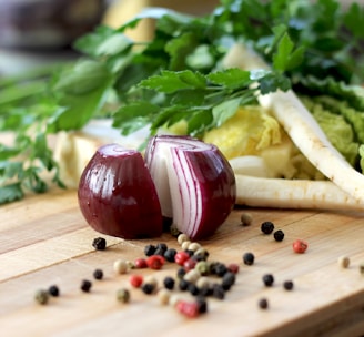 red onion on brown wooden chopping board