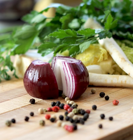red onion on brown wooden chopping board