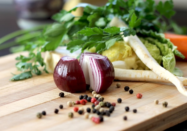 red onion on brown wooden chopping board