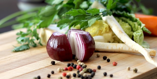 red onion on brown wooden chopping board