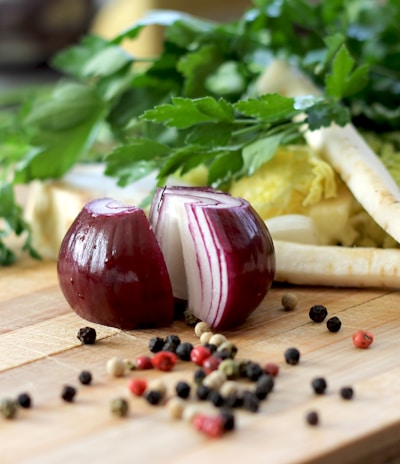 red onion on brown wooden chopping board