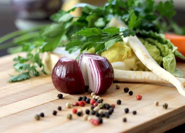 red onion on brown wooden chopping board