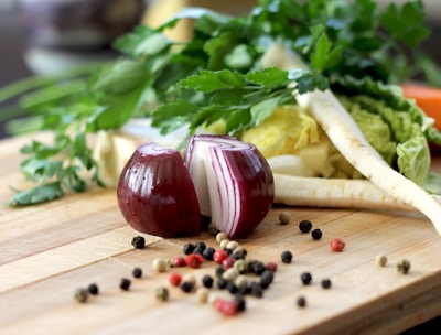red onion on brown wooden chopping board