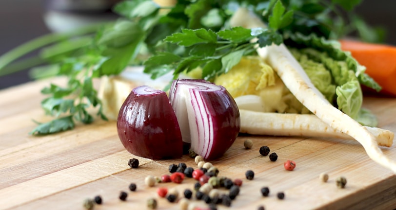 red onion on brown wooden chopping board