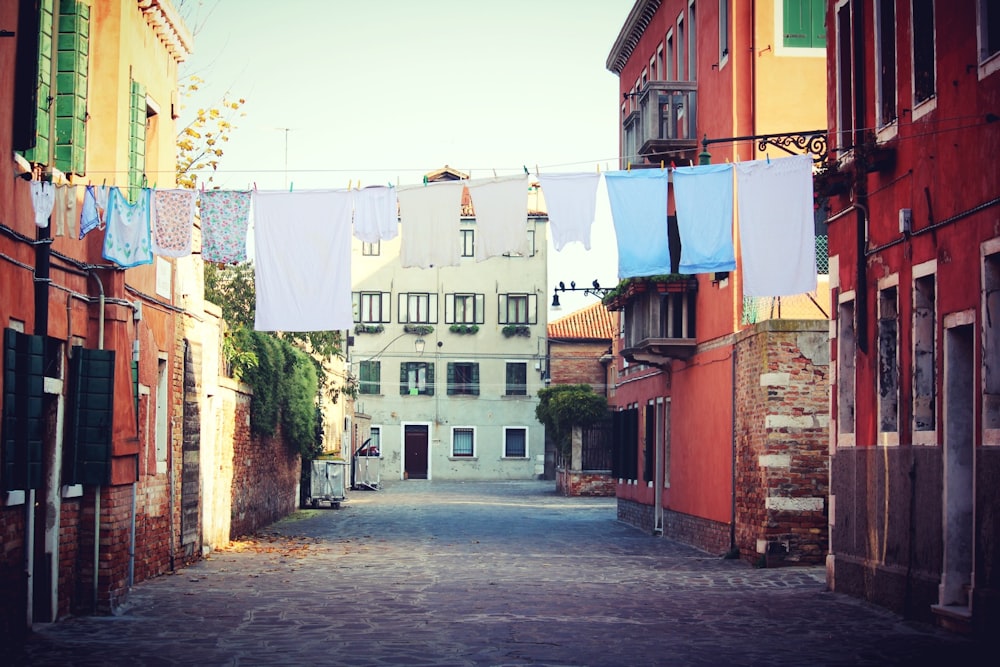 clothes hanging on drying rack in street