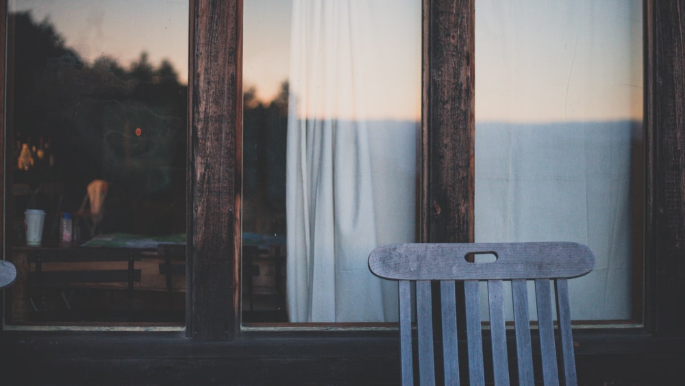 brown wooden chair near brown wooden door