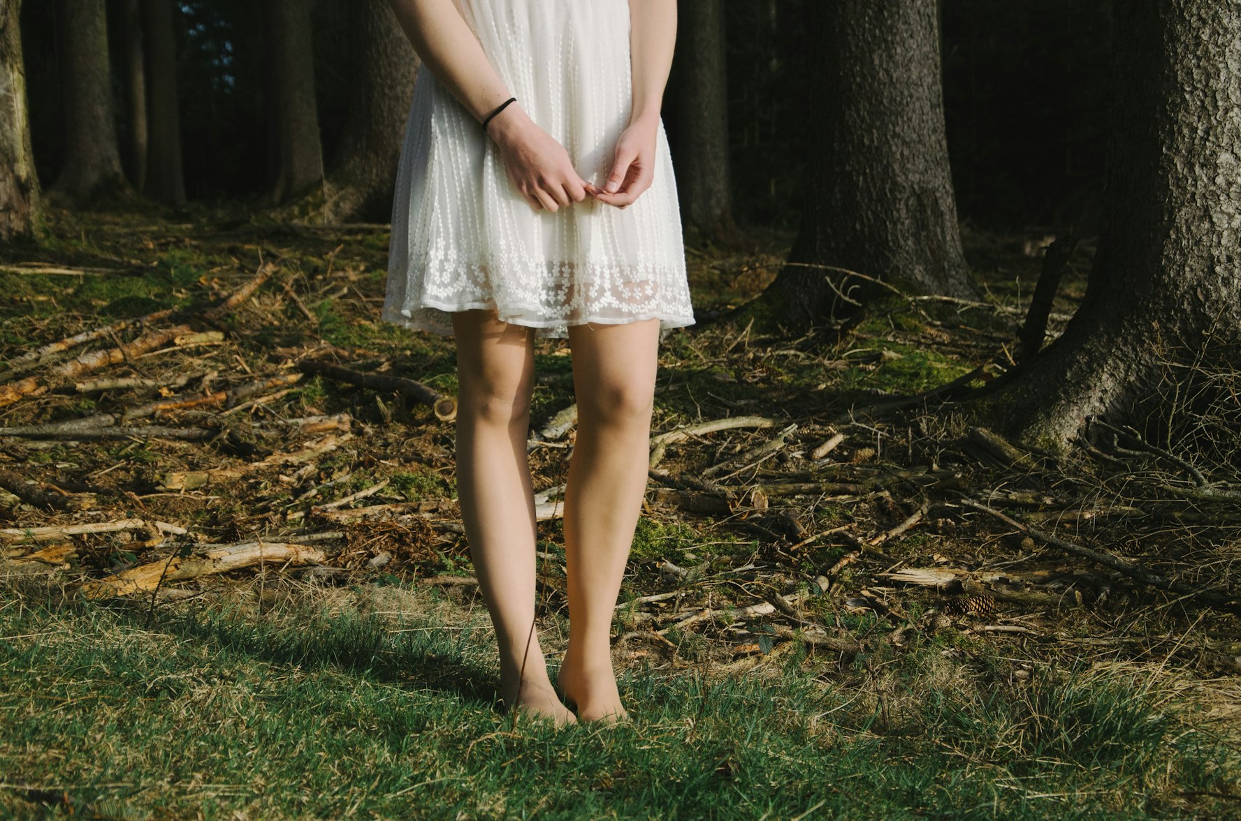 Woman in a dress by a forest, by Unsplash