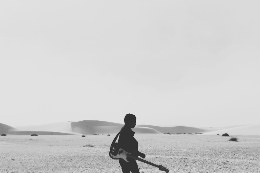 silhouette of person with guitar