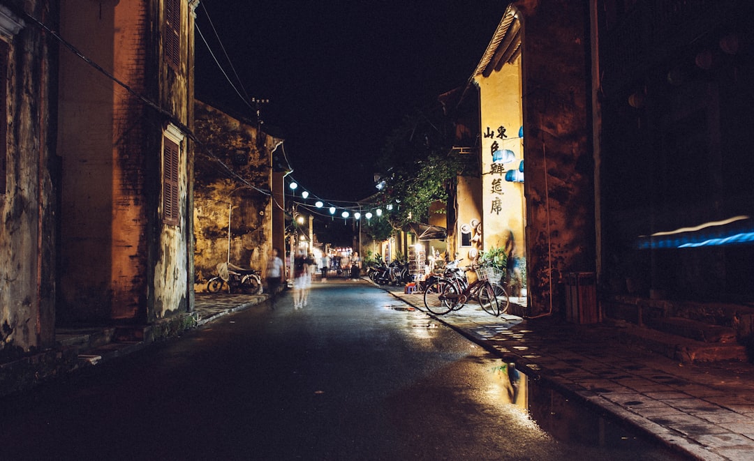 street beside village with lights during night time