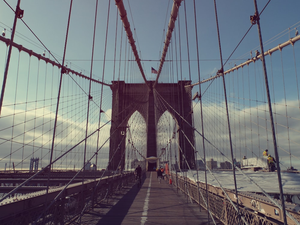 gray concrete bridge under white and blue sky