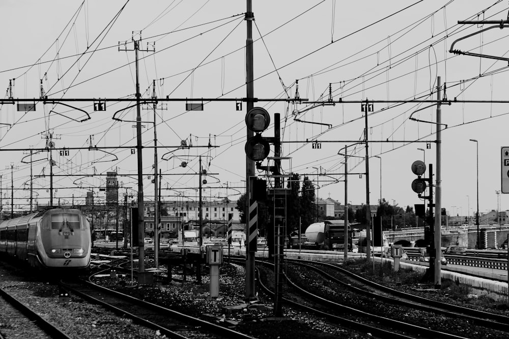 grayscale photo of black posts during cloudy season