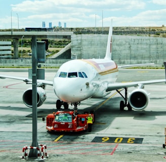 white airplane on airport during day time