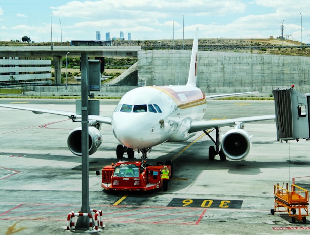 white airplane on airport during day time
