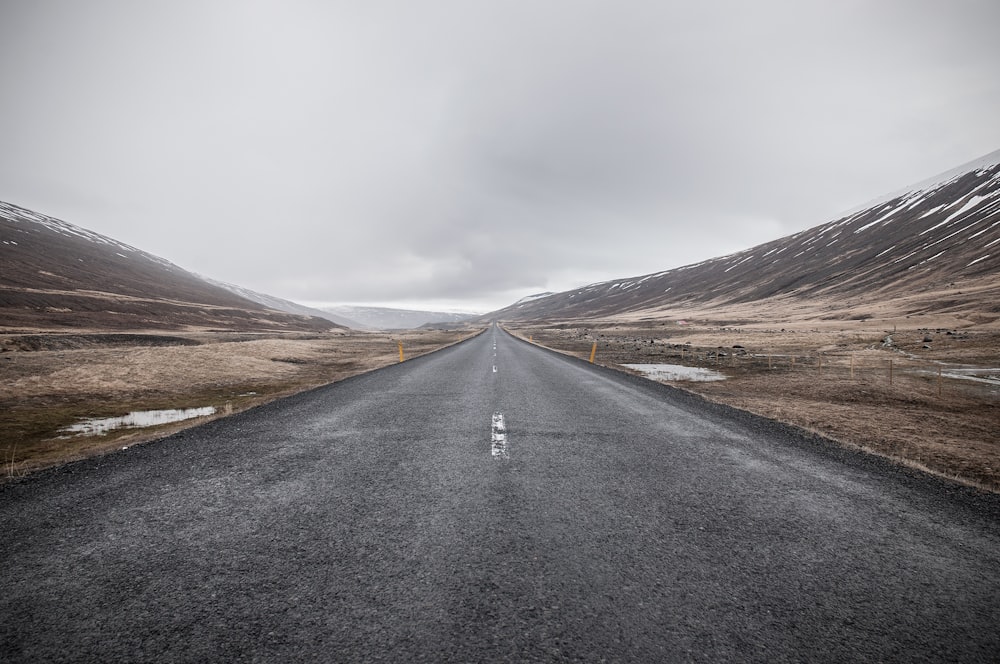 empty asphalt road through mountain