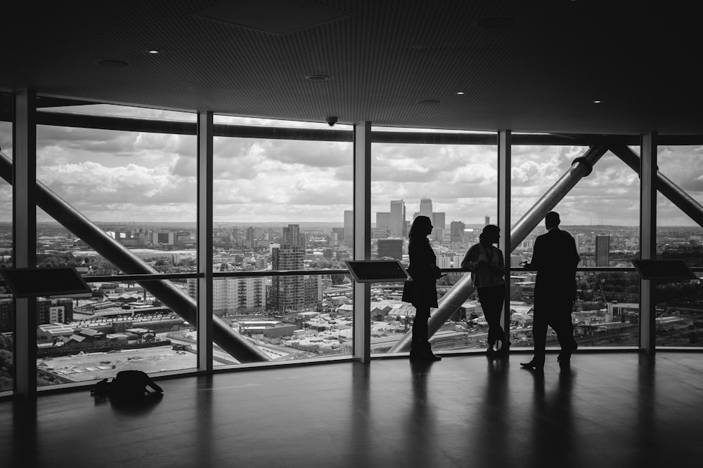 people standing inside city building