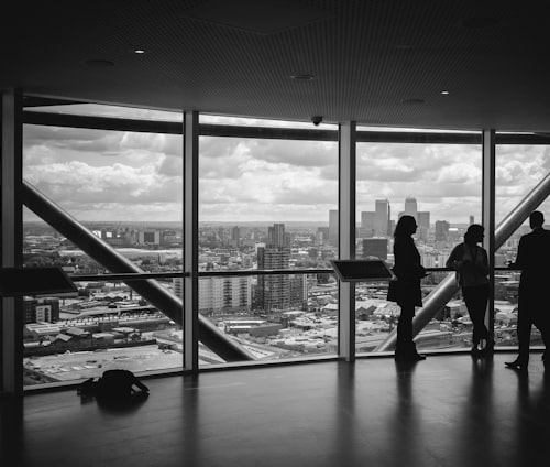 people standing inside city building
