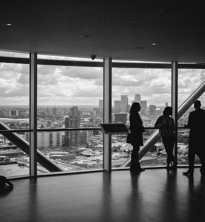people standing inside city building
