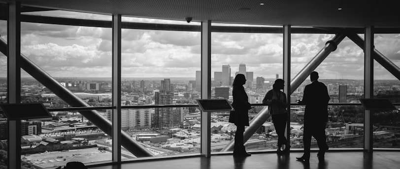 people standing inside city building