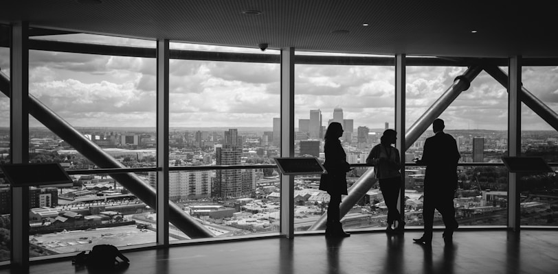 people standing inside city building