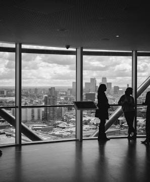 people standing inside city building