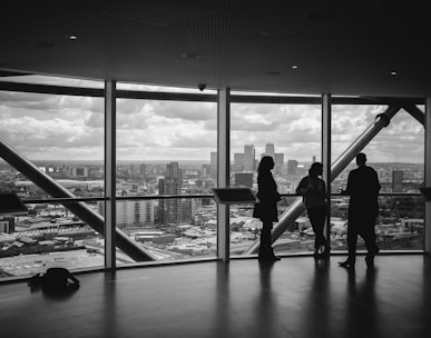 people standing inside city building