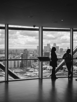 people standing inside city building