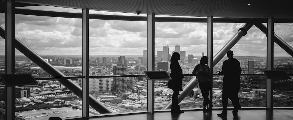 people standing inside city building