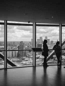 people standing inside city building