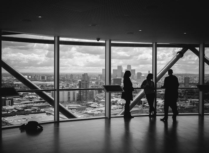 people standing inside city building