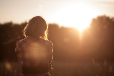 woman looking at trees contemplative zoom background