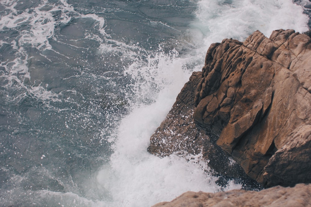 splashing waves on rock