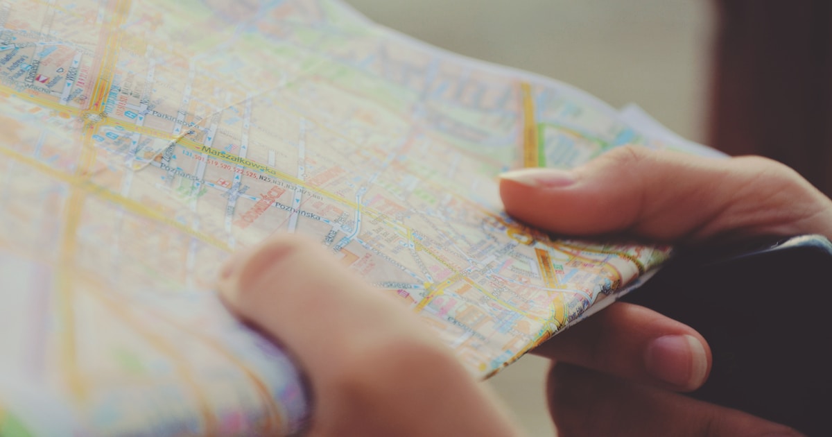 Can a checklist app help reduce travel stress? by Travel Checklist person holding map