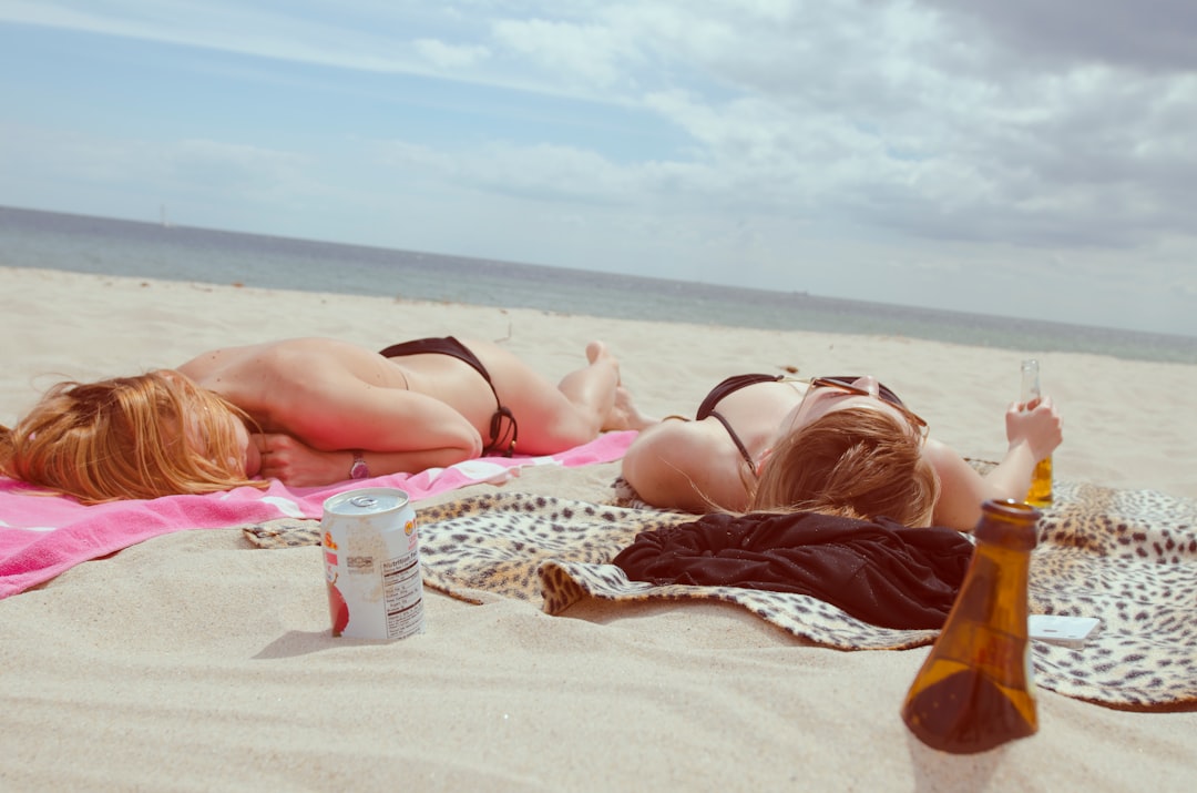 Women Sunbathing on Beach