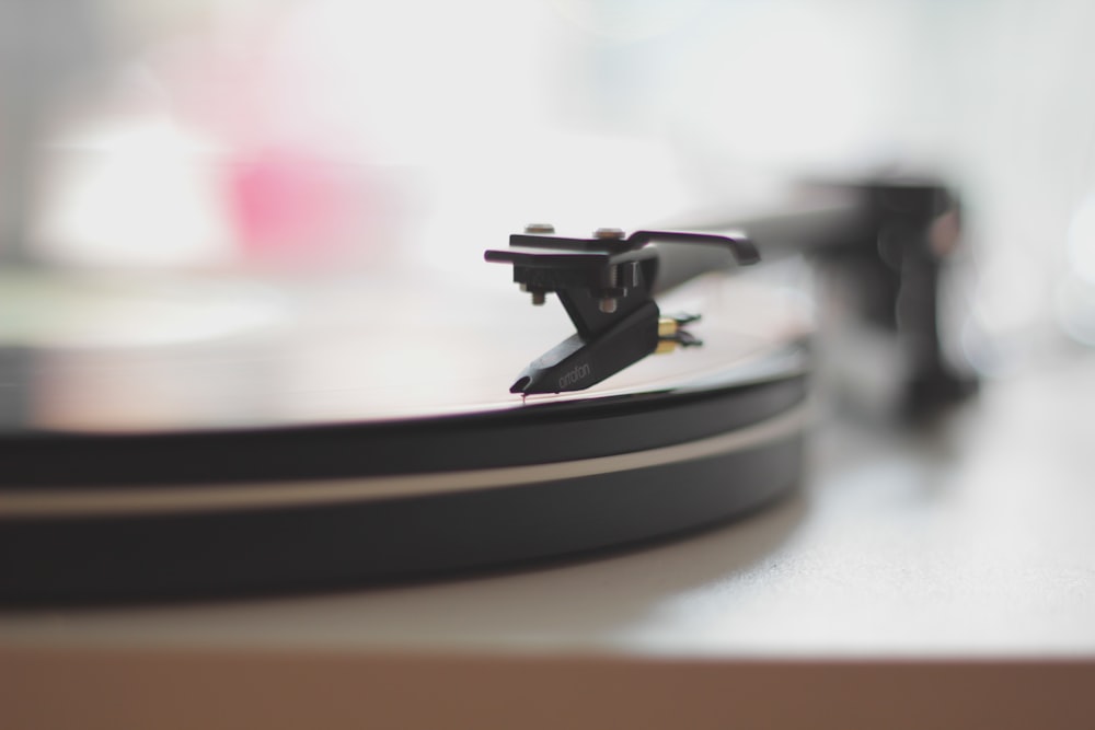 A blurry close-up of a turntable needle