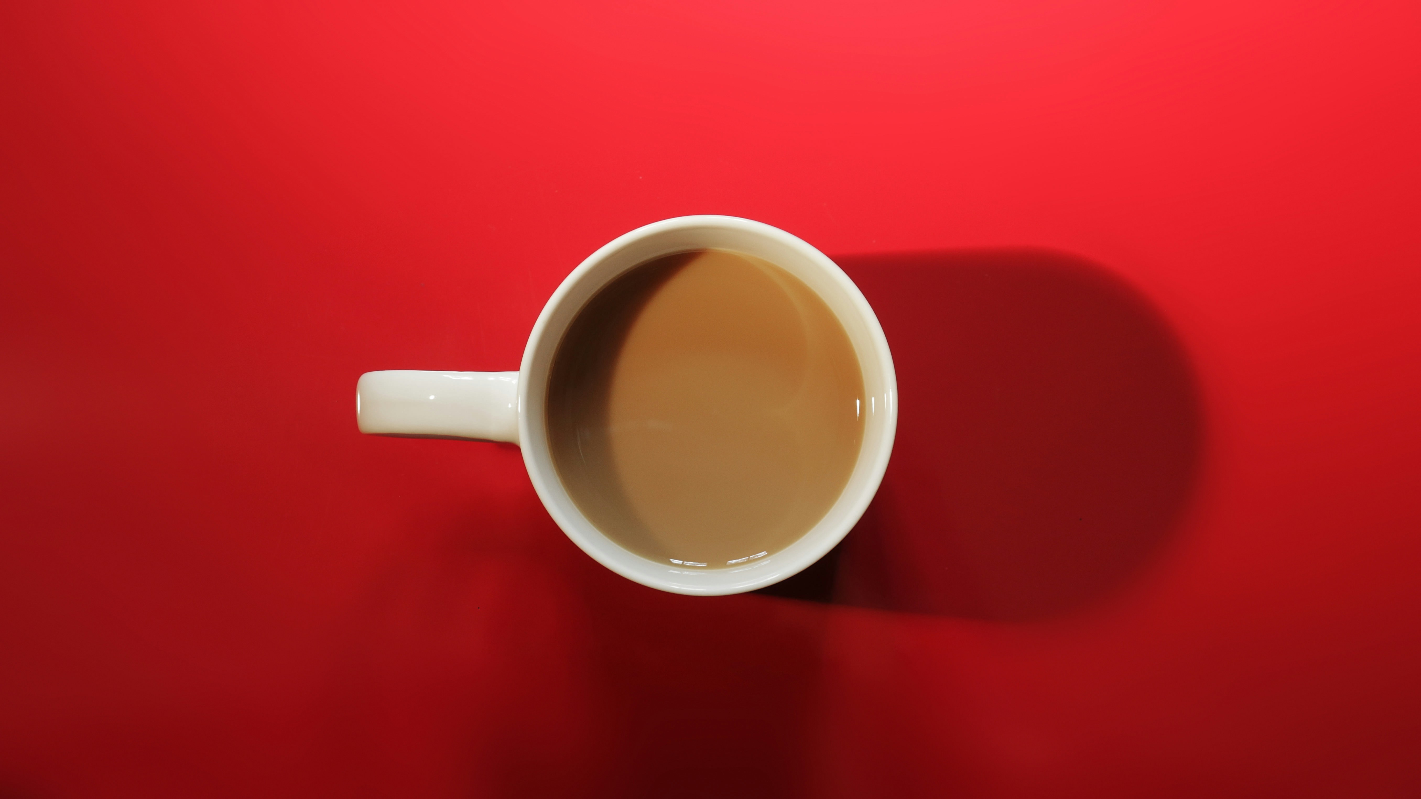 coffee mug in a red background