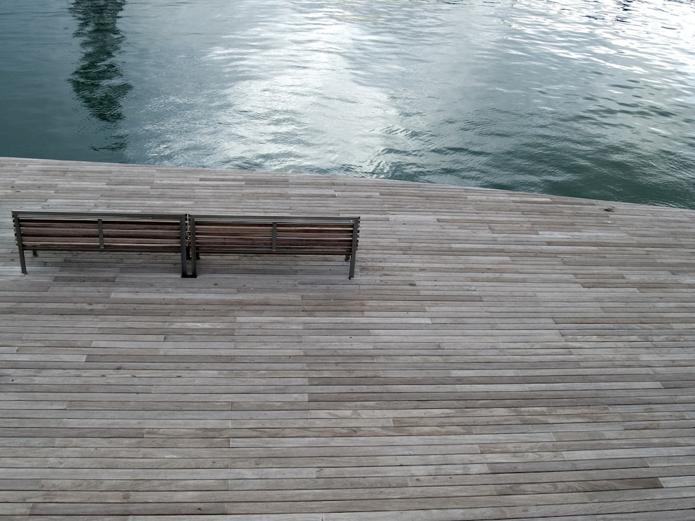 aerial photography of bench near body of water