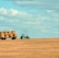 brown hay on tractor under white and blue sky during daytime