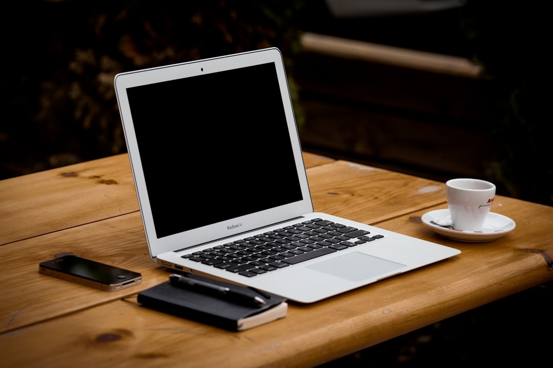 Photo by Alejandro Escamilla MacBook Air near mug on table