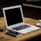 MacBook Air near mug on table