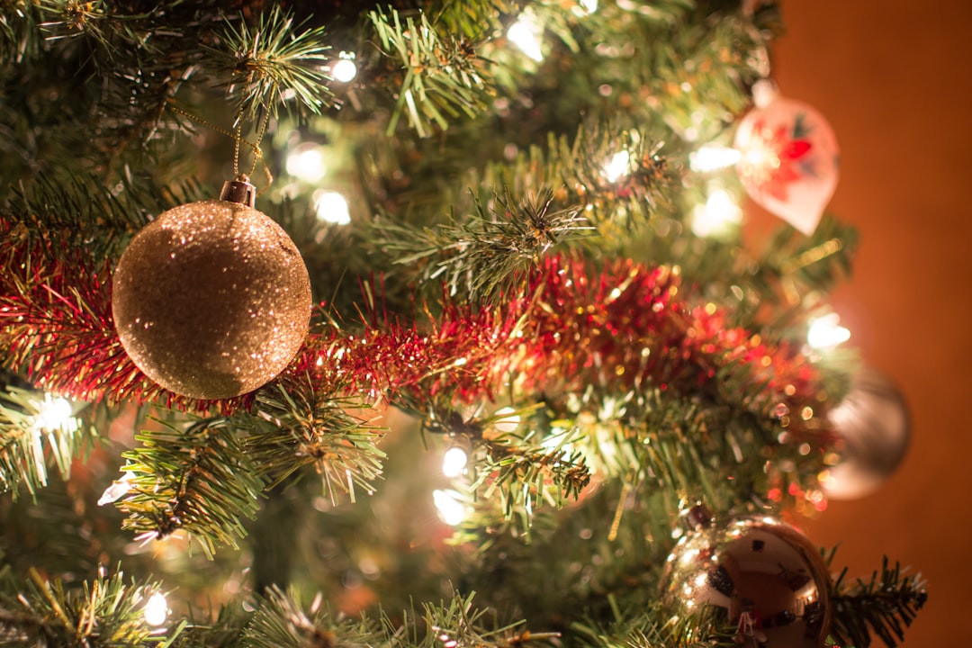 close view of lighted Christmas tree with decors,
