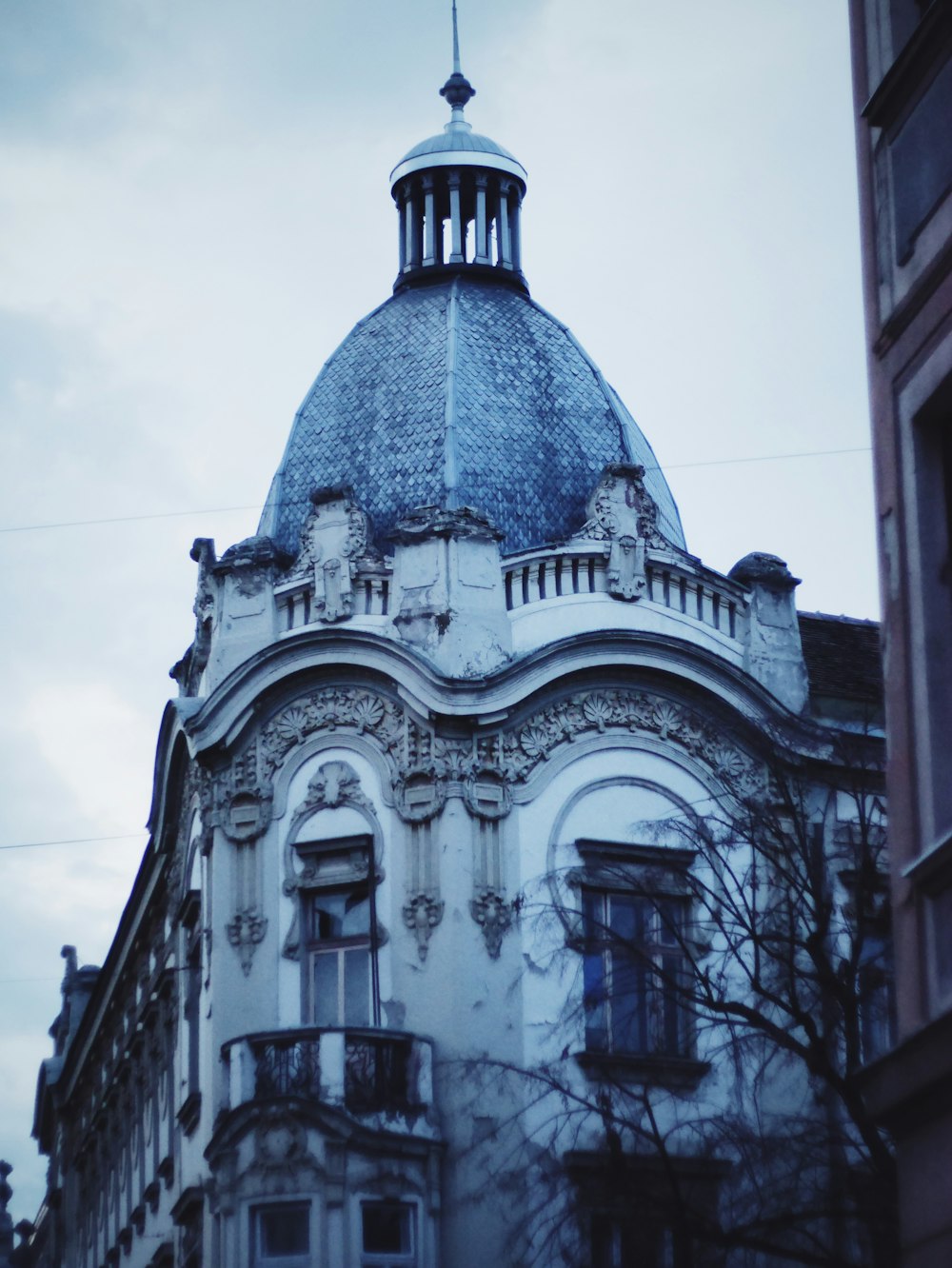 gray concrete building under white sky during daytime