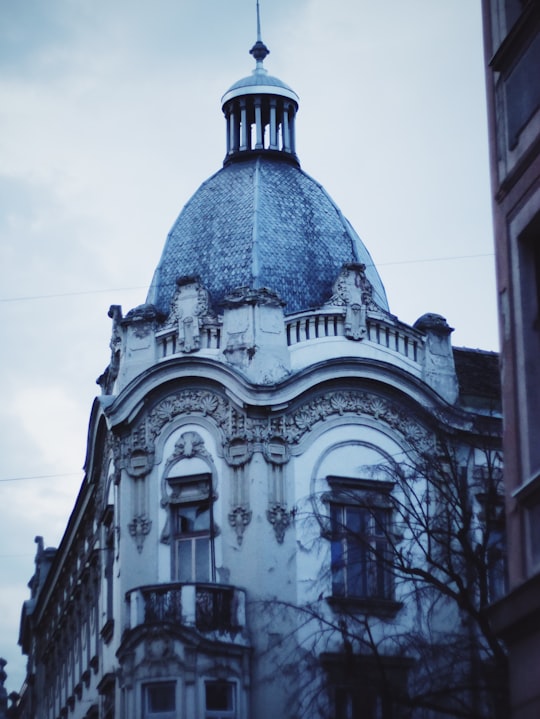 gray concrete building under white sky during daytime in Osijek Croatia