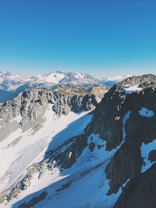 snow covered mountain under blue sky during daytime in Garibaldi Provincial Park Canada